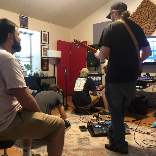 band recording music in a studio